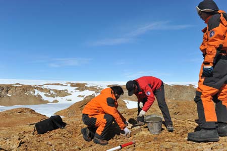 Members of Chinese 25th Antarctic expedition team make cement foundation in Antarctica, on Dec. 30, 2008. The Chinese 25th Antarctic expedition team carried out scientific research on cartography and biologic sampling to study the terrain and environment of Antarctica on Tuesday. [Liu Yizhan/Xinhua] 