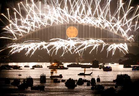 Fireworks explode over the Sydney Harbour Bridge during a pyrotechnics show to celebrate the New Year Jan. 1, 2009. Known for its choreographed and themed fireworks displays, this year's show, nicknamed 'The Creation Storm', drew hundreds of thousands of people to the harbour foreshore to watch the spectacle. [Xinhua]