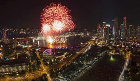 Fireworks explode over Marina Bay and the Esplanade theatre during a pyrotechnic show to celebrate the New Year in Singapore January 1, 2009. 