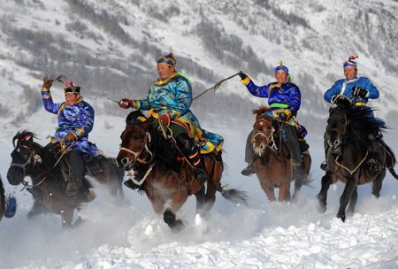 Locals compete in a horse racing in the Kanasi Nature Reserve of northwest China's Uygur Autonomous Region Jan. 2, 2008. The match was part of a photography festival held here Friday, which the local tourism authority hoped could draw photography fans to catch the beautiful sceneries and cultures and life of locals in Kanasi and in turn help promote tourism.