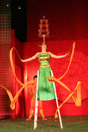 Acrobats from southeast China's Fujian Province perform during the Chinese Culture and Travel exhibition in Singapore, on Jan. 2, 2009. An exhibition introducing Chinese culture, artworks and travel was held at Raffles City Shopping Center in Singapore on Friday.