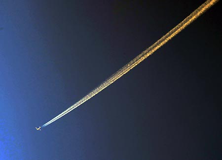 Smoke trails of an Israeli air force jet is seen above the southern Israeli city of Sderot on Jan. 3, 2009. Israeli artillery shelled Gaza Strip on Saturday, following with the ground offensive. 