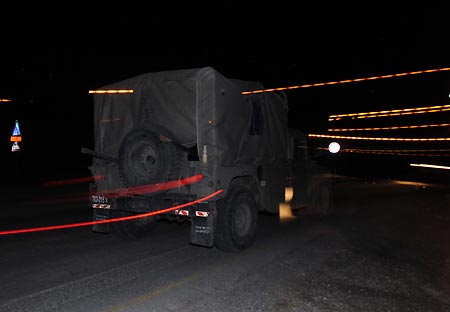 An Israeli military vehicle runs to north Gaza Strip after Israel started the ground operation on Jan. 3, 2009. The Israel Defense Forces (IDF) Saturday evening began its ground operation in the Hamas-ruled Gaza Strip, an IDF spokesman told Xinhua. 