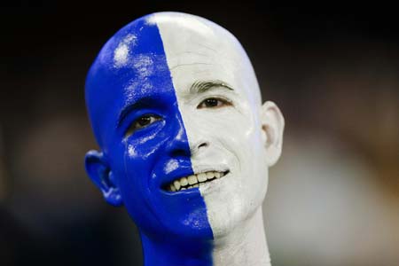 A Connecticut Huskies fan sits in the stands as his team plays the Buffalo Bulls during the first half of their NCAA International Bowl football game in Toronto January 3, 2009. 