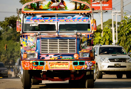 A bus with colorful paintings runs in Panama City, Panama, Jan. 2, 2009.