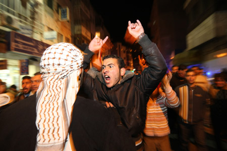 A Palestinian shouts slogans at a demonstration in downtown Ramallah against Israel's ground operation on the Gaza Strip, Jan 3, 2009. 