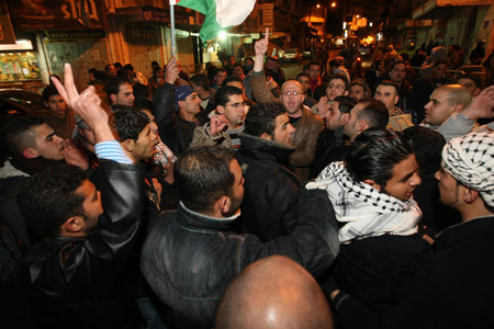 Palestinians shout slogans at a demonstration in downtown Ramallah against Israel's ground operation on the Gaza Strip, Jan 3, 2009.