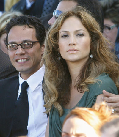 Singers Marc Anthony (L) and Jennifer Lopez attend the inauguration of Puerto Rico's Governor Luis Fortuno in the North wing of the Capitol Building in San Juan January 2, 2009. 