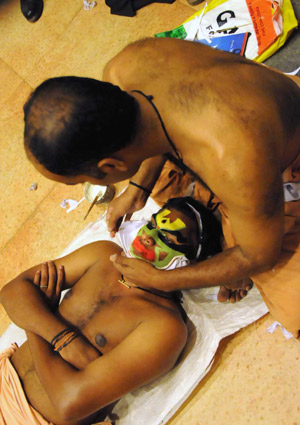 Indian Kathakali artists prepare to perform in Kerala state of India, Jan. 1, 2009. 