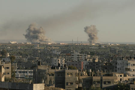 Smokes rise following an Israeli airstrike on an area known to have smuggling tunnels in Rafah, in the southern Gaza Strip on the border with Egypt, Jan. 3, 2009. 