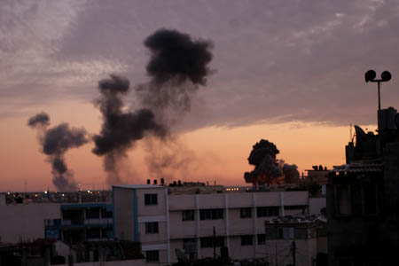 Smokes rise following an Israeli airstrike on an area known to have smuggling tunnels in Rafah, in the southern Gaza Strip on the border with Egypt, Jan. 3, 2009. 
