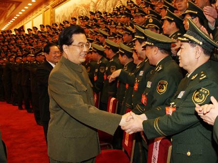 Chinese President Hu Jintao (L Front) meets with delegates to a plenary session of the Committee of the Chinese People's Armed Police Corps (PAPC) of the Communist Party of China, in Beijing, capital of China, Jan. 4, 2009. Wang [Jianmin/Xinhua]