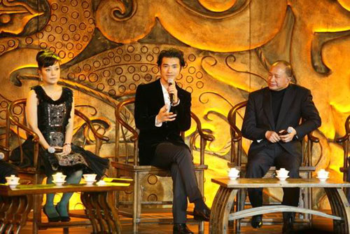 Cast member Takeshi Kaneshiro (center) talks about the new film 'Red Cliff II' as director John Woo (right) and actress Zhao Wei look upon during the film's premiere in Beijing on January 4, 2009. 