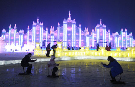 People play at the Harbin Ice and Snow World in Harbin, capital of northeast China's Heilongjiang Province, Jan. 5, 2009. The 25th Harbin International Ice and Snow Festival of China was opened on Monday at the local park in Harbin, capital of northeast China's Heilongjiang province, featuring ice and snow art, sports, trade and tourism.[Wang Jianwei/Xinhua]