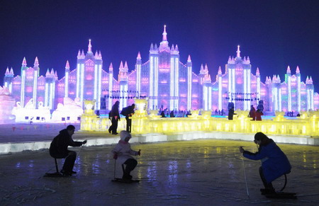 People skate near giant ice sculptures at the Ice and Snow World Park in Harbin, northeast China's Heilongjiang Province January 5, 2009. [Xinhua] 