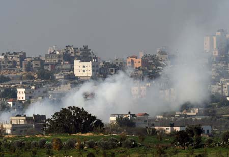 Smokes rise following Israeli airstrikes in the northern Gaza Strip Jan. 5, 2009. Israel continued on Monday its military attacks on the Palestinians in the Gaza Strip since the start on Dec. 27, 2008, leaving at least 514 people dead and 2,600 others wounded. [Yin Bogu/Xinhua]