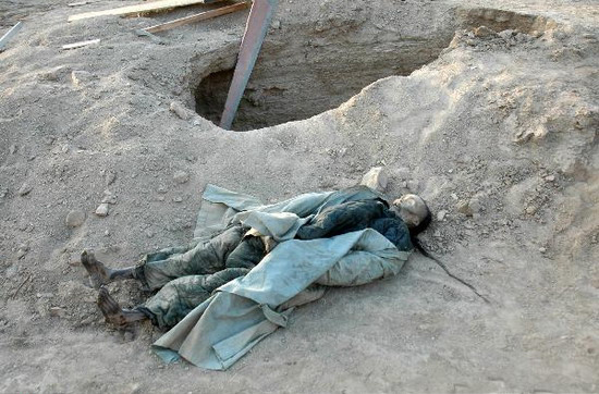 This photo, taken on Tuesday, January 6, 2009, shows a mummified corpse that dates back to Qing Dynasty. It was found recently in Turpan region in northwest China's Xinjiang Uygur Autonomous Region. Construction workers excavated a total of five male mummies the day before. The excavation site has been cordoned off for protection. 