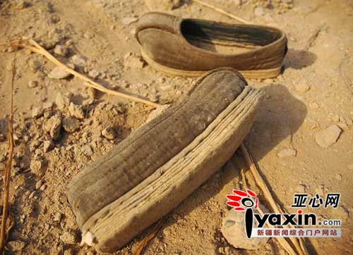 This photo, taken on Tuesday, January 6, 2009, shows a pair of cotton shoes especially made for the deceased, unearthed along with five mummified corpses in Turpan region in northwest China's Xinjiang Uygur Autonomous Region.