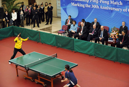 Chinese and U.S. ping-pong players compete during the Friendship Ping-pong Match marking the 30th anniversary of the establishment of the China-U.S. diplomatic relations at the State General Administration of Sport in Beijing, capital of China, Jan. 7, 2009.[Rao Aimin/Xinhua]