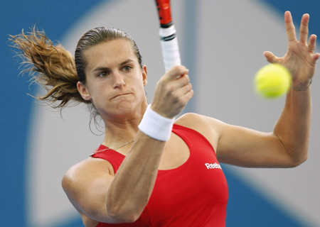 France's Amelie Mauresmo hits a forehand against Serbia's Ana Ivanovic during their match at the Brisbane International tennis tournament Jan. 8, 2009. Mauresmo, the Australian Open and Wimbledon champion in 2006, dropped serve only once while breaking Ivanovic five times to advance to the semifinals 6-3, 6-2. [Xinhua/Reuters]