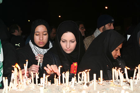 Irani women light candles during a rally at the Palestine Square in Tehran, capital of Iran, Jan. 7, 2009. Thousands of Irani people gathered at the square Wednesday night to support the Palestinian people.[Che Ling/Xinhua]