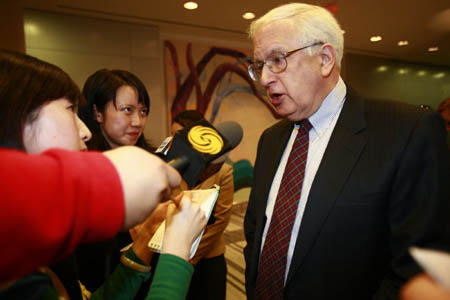 Stapleton Roy (R), former U.S. ambassador to China, speaks to reporters during a reception marking the 30th anniversary of China-U.S. diplomatic relations in Beijing Jan. 11, 2009. During the reception held by the U.S. embassy in China on Sunday, four U.S. ambassadors eyed a continued China policy under the Obama administration. [Xinhua]