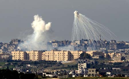 A weapons system fired by Israeli forces explodes over the northern Gaza Strip January 10, 2009. Israeli tanks advanced on Gaza and Hamas militants fired rockets at Israel on Saturday, as both sides ignored international calls to stop the conflict and Israel warned it would escalate its assault. 