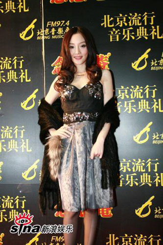 Li Xiaolu poses for photos at the Beijing Pop Music Awards ceremony, organized by Beijing Music Radio FM 97.4 on Sunday, January 11th, 2009. 