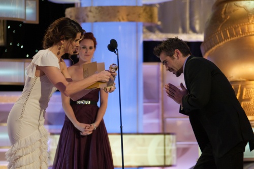 Colin Farrell accepts the Golden Globe Award for Best Performance by an Actor in a Motion Picture Comedy or Musical from Sandra Bullock, for his role in 'In Breges' at the 66th Annual Golden Globe Awards at the Beverly Hilton in Beverly Hills, CA Sunday, January 11, 2009.