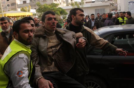 A wounded Palestinian man is sent to the Kamal Adwan hospital after an Israeli air strike on Jan. 11, 2009 in Beit Lahia, Gaza Strip. Israel's ongoing attacks on Hamas targets in the Gaza Strip have claimed almost 900 lives. [Xinhua]