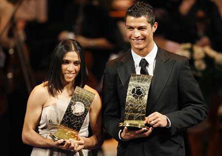 Soccer players Cristiano Ronaldo from Portugal, right, and Marta from Brazil, left, pose with their trophies after being named FIFA Men's and Women's World Player of the Year during the FIFA World Player Gala 2008 at the Opera house in Zurich, Switzerland, Monday, Jan. 12, 2009. [Xinhua/Reuters] 