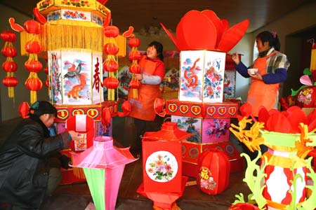 Workers make lanterns at a workshop at Hongmiao Village in Huairou District of Beijing, capital of China, Jan. 12, 2009. Some 2,200 lanterns have been made at the workshop for the Spring festival since the beginning of the last month of the lunar year. (Xinhua/Bu Xiangdong) 
