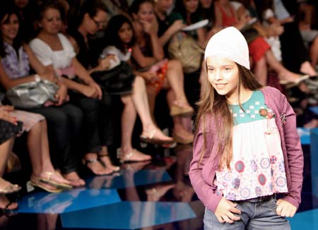 A girl displays a creation designed by Lilica Ripilica during a fashion show in Rio De Janeiro Jan. 11, 2009.