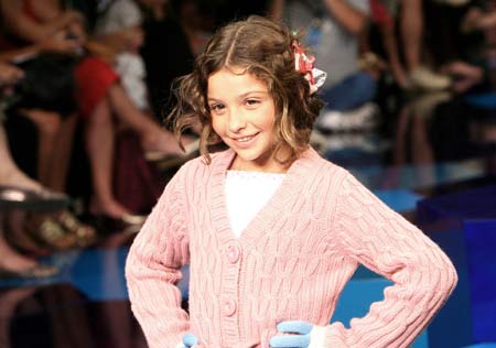 A girl displays a creation designed by Lilica Ripilica during a fashion show in Rio De Janeiro Jan. 11, 2009.