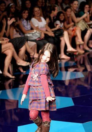 A girl displays a creation designed by Lilica Ripilica during a fashion show in Rio De Janeiro Jan. 11, 2009.