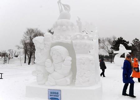 The snow carving Happy Birthday is presented during the 14th Harbin International Snow Carving Contest in Harbin, capital of north China's Heilongjiang Province Jan. 13, 2009. 