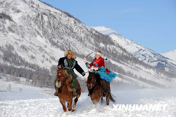 Local Kazak people in Kanas perform a horse riding show for tourists in this photo published by Xinhua News Agency. [Photo: Xinhuanet]