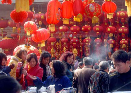 People buy goods as Spring Festival draws near