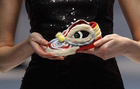 A model displays 'Lion Dance', the 2nd runner-up of the kids' footwear category in the territory's annual Footwear Design Competition Awards, during Hong Kong Fashion Week for Fall/Winter 2009 on Jan. 13, 2009. 