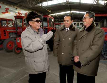 This undated picture, released from Korean Central News Agency on Jan. 14, 2008, shows Kim Jong Il (L), top leader of the Democratic People's Republic of Korea (DPRK), inspecting two machinery plants.[Xinhua/Korean Central News Agency]