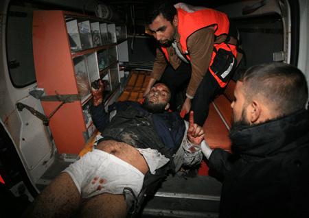 Palestinian medics send a wounded man, who was hurt in an Israeli strike, to Shifa hospital in Gaza City, Jan. 13, 2009.[Xinhua]