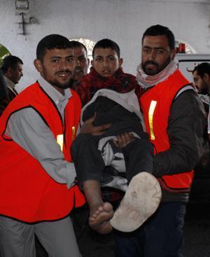 A Palestinian who was injured in an Israeli army strike is rushed to Shifa hospital in Gaza City, Tuesday, Jan. 13, 2009. [Xinhua]