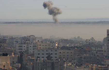 Smoke is seen during an Israeli military operation in Gaza City, on Jan. 15, 2009. At least 30 Palestinians in the Gaza Strip were killed on Thursday until morning hours, as Israeli ground forces pushed deeper into densely populated areas of Gaza City, medical sources and witnesses said. The overall Palestinian death toll in the massive Israeli military offensive 'cast lead' has reached about 1,060, according to the sources. [Wissam Nassar/Xinhua]