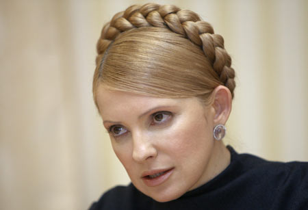 Ukrainian Prime Minister Yulia Tymoshenko speaks to her Bulgarian counterpart Sergei Stanishev in Kiev late January 14, 2009. European states saw little prospect of renewed gas supplies from Russia on Thursday, with Moscow and Kiev bickering over the venue of a summit called to help resolve the stand-off. Picture taken January 14, 2009.[Xinhua/Reuters]