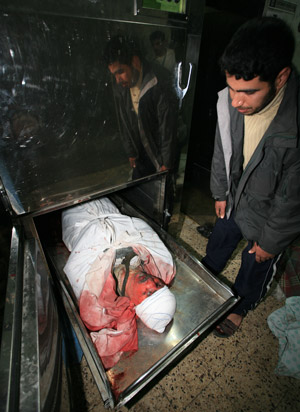 The body of Hamas leader Said Siam lies in the mortuary of Al-Shifa hospital in Gaza City on Jan. 15, 2009, after he was killed in an Israeli air strike. [Xinhua]