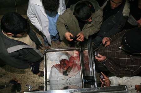 The body of Hamas leader Said Siam lies in the mortuary of Al-Shifa hospital in Gaza City on Jan. 15, 2009, after he was killed in an Israeli air strike. [Xinhua]