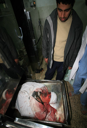 The body of Hamas leader Said Siam lies in the mortuary of Al-Shifa hospital in Gaza City on Jan. 15, 2009, after he was killed in an Israeli air strike. [Xinhua]