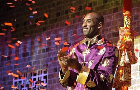 NBA basketball player Kobe Bryant, wearing a traditional Chinese coat, announces the launch of his blog and official Chinese website during a news conference in Los Angeles on Thursday, Jan. 15, 2009. 