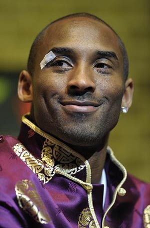 NBA basketball player Kobe Bryant, wearing a traditional Chinese coat, announces the launch of his blog and official Chinese website during a news conference in Los Angeles on Thursday, Jan. 15, 2009. 