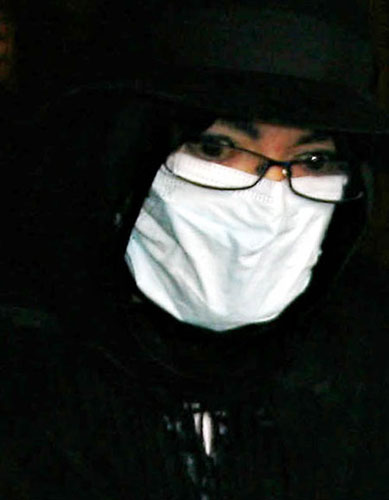 Pop star Michael Jackson is seen wearing a surgical mask and leaving a medical building in Beverly Hills on Wednesday. 